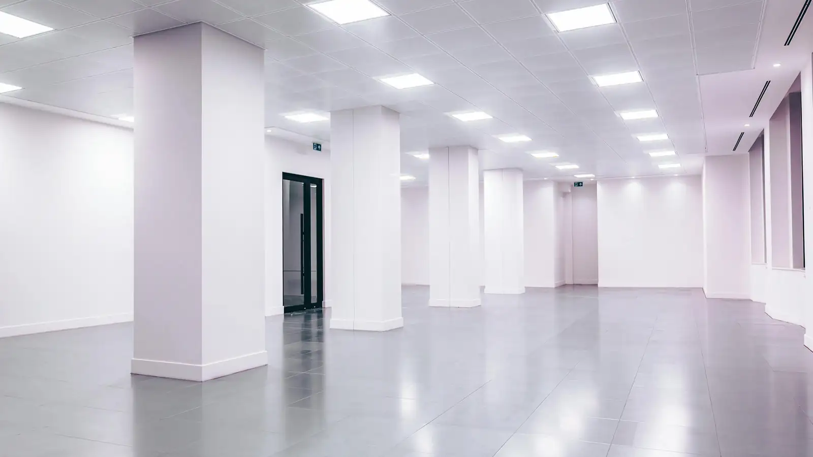 Cleaner polishing corporate hallway floor